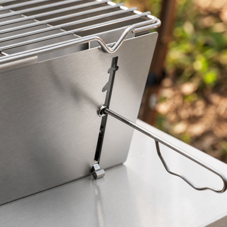 Portable charcoal grill in use